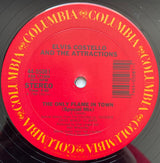 Elvis Costello & The Attractions : The Only Flame In Town (12", Single, Pit)